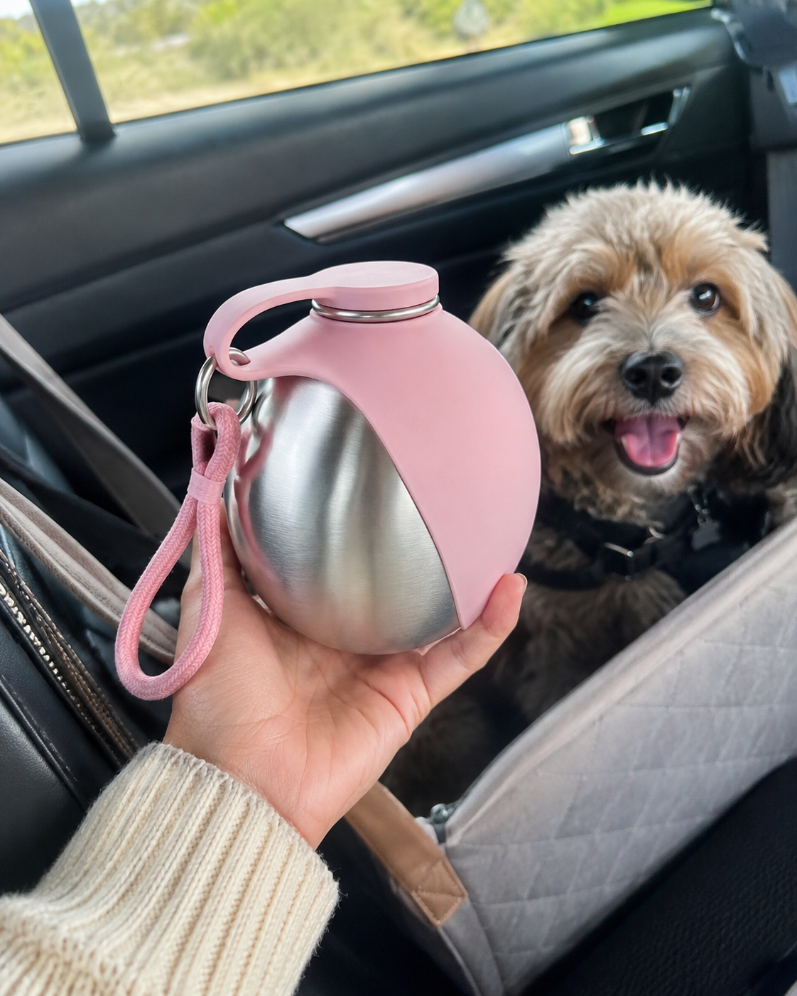 Pink portable dog water bottle for road trips